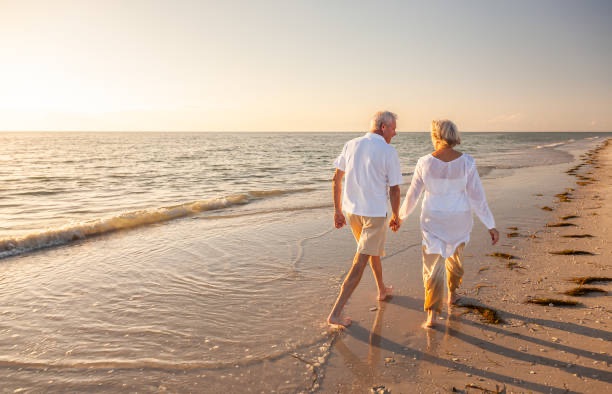 adults reviewing retirement savings plans at home by age group”