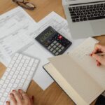 Home office scene illustrating Tax Deductions Every Freelancer Should Claim When Working from Home with laptop and documents