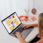 Workspace setup showing a laptop and planner, perfect for those who want to make money on Etsy without products, selling printables Etsy beginner.