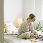 Budget planner with envelopes and calculator showing steps to stop living paycheck to paycheck