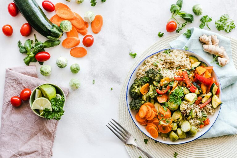 Colorful plate of High Protein Vegetarian Meals with beans, quinoa, and vegetables served on a rustic wooden table.