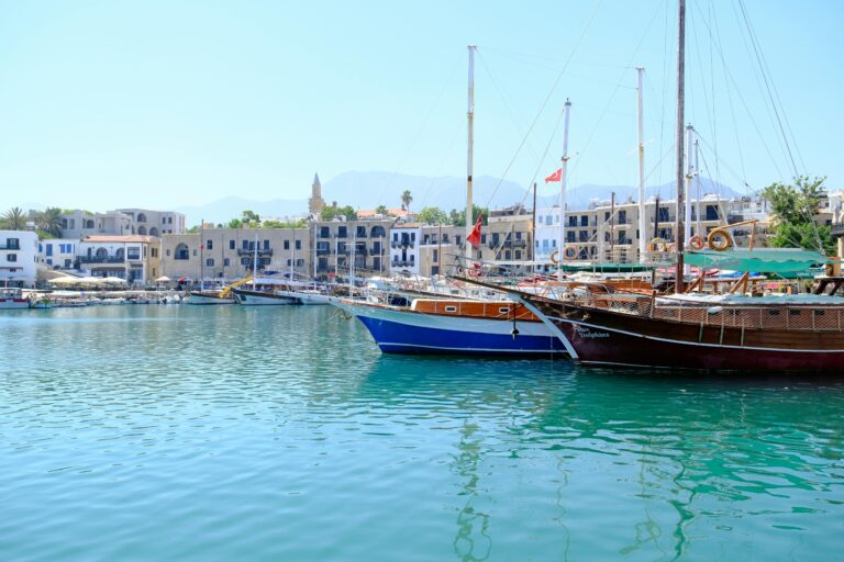 Backpack, map, and budget planner showing how to travel Europe on $1000 a month affordably